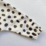 Long Sleeved Baby Bib - Spotty print